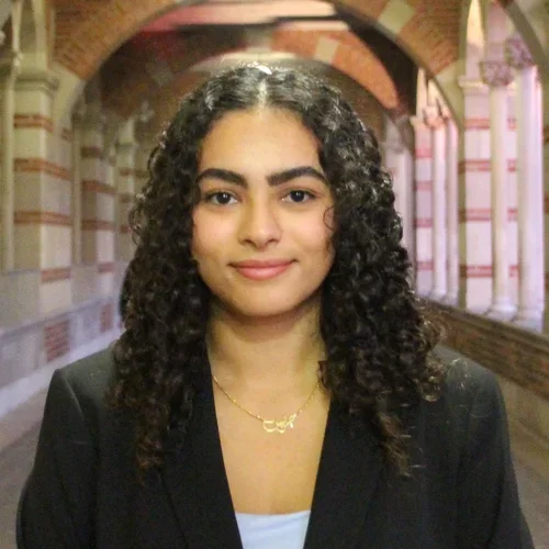 Grace Haroun standing in a outdoor corridor/hallway at UCLA