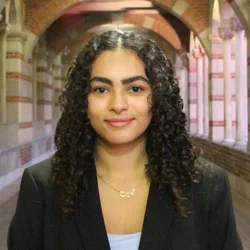 Grace Haroun standing in a outdoor corridor/hallway at UCLA